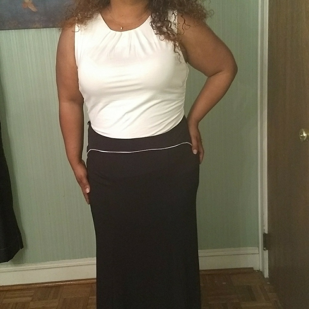 White sleeveless Shirt w/ long Black trumpet skirt